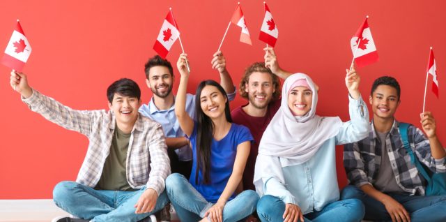 Immigrants wave Canadian flags